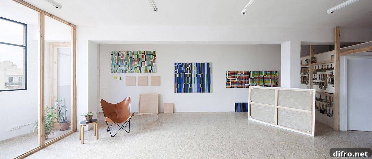 Interior view of modern Barcelona art studio with wooden frame and glass partitions
