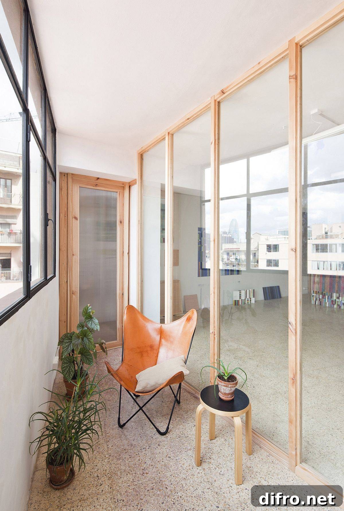 Wooden frames and glass walls creating new layout in Barcelona studio