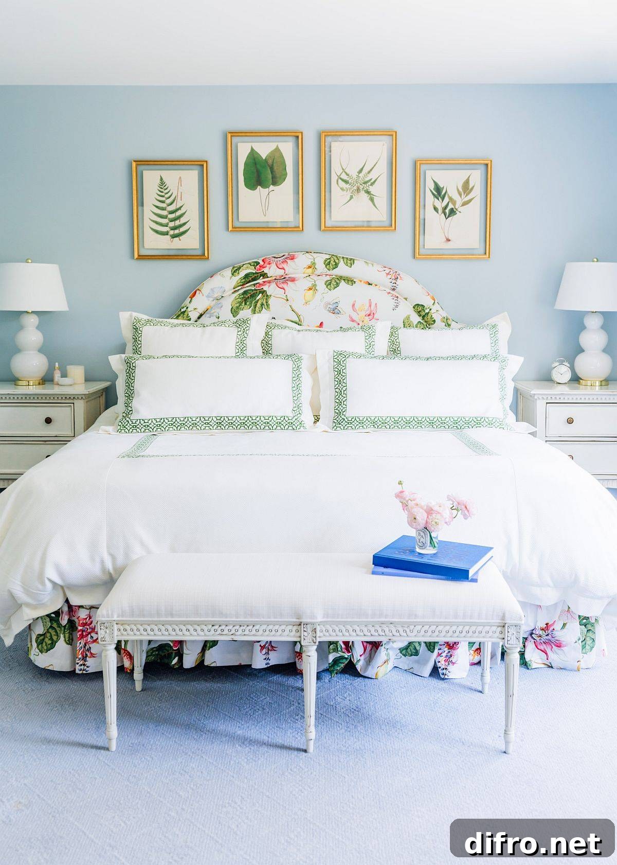 Elegant light blue and white bedroom with botanical accents