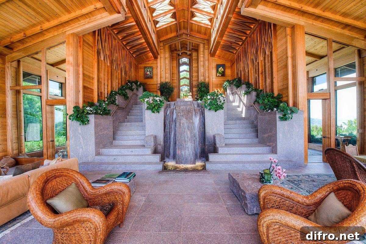 Indoor staircase with water feature and plants for natural cooling