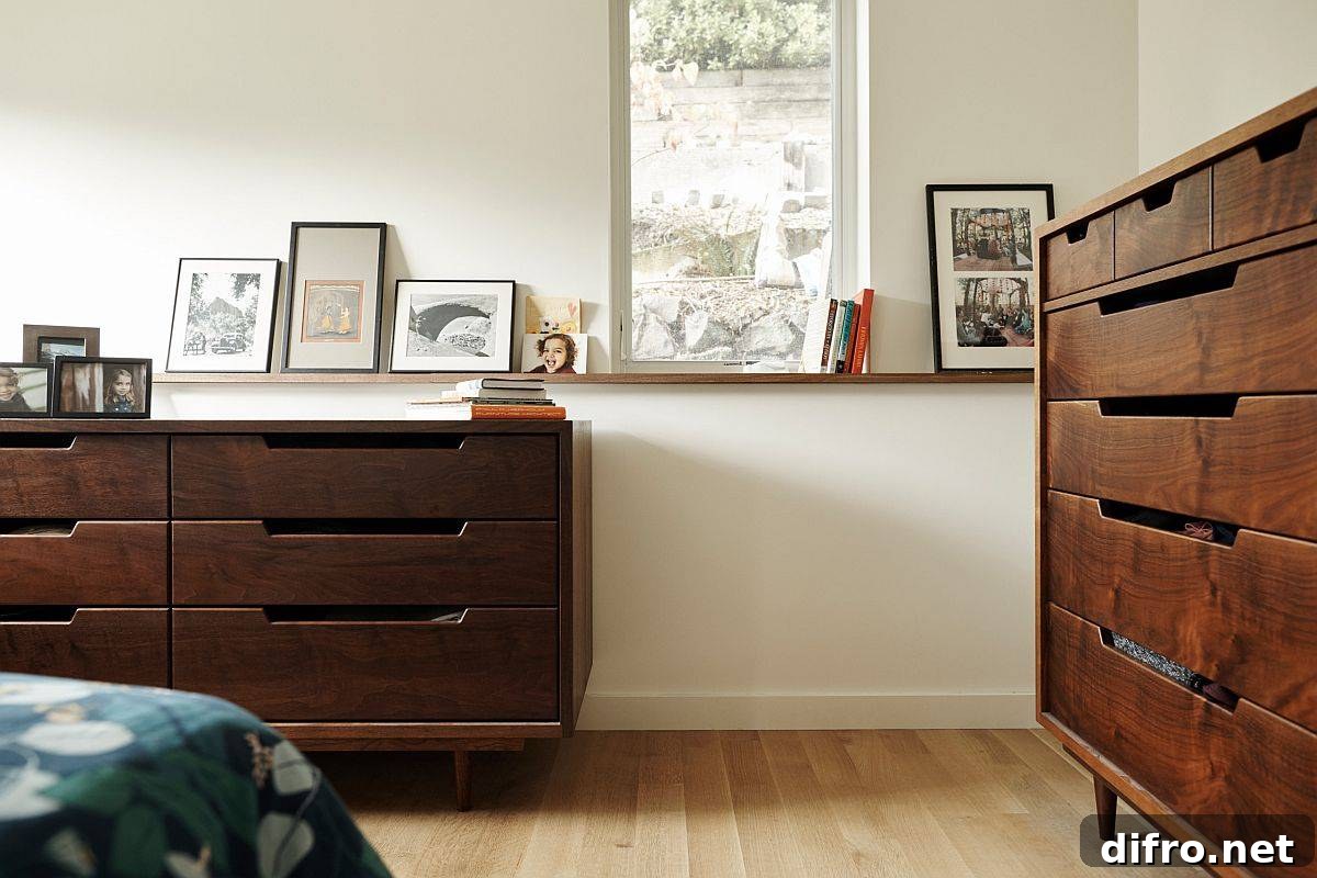Bright bedroom with wooden drawers and plenty of natural light