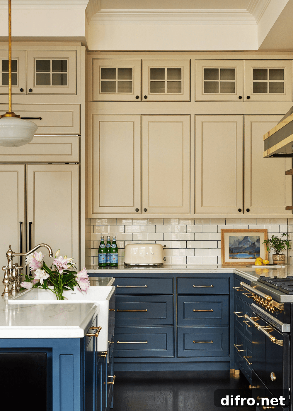 warm beige upper kitchen cabinets with dark blue lower cabinets