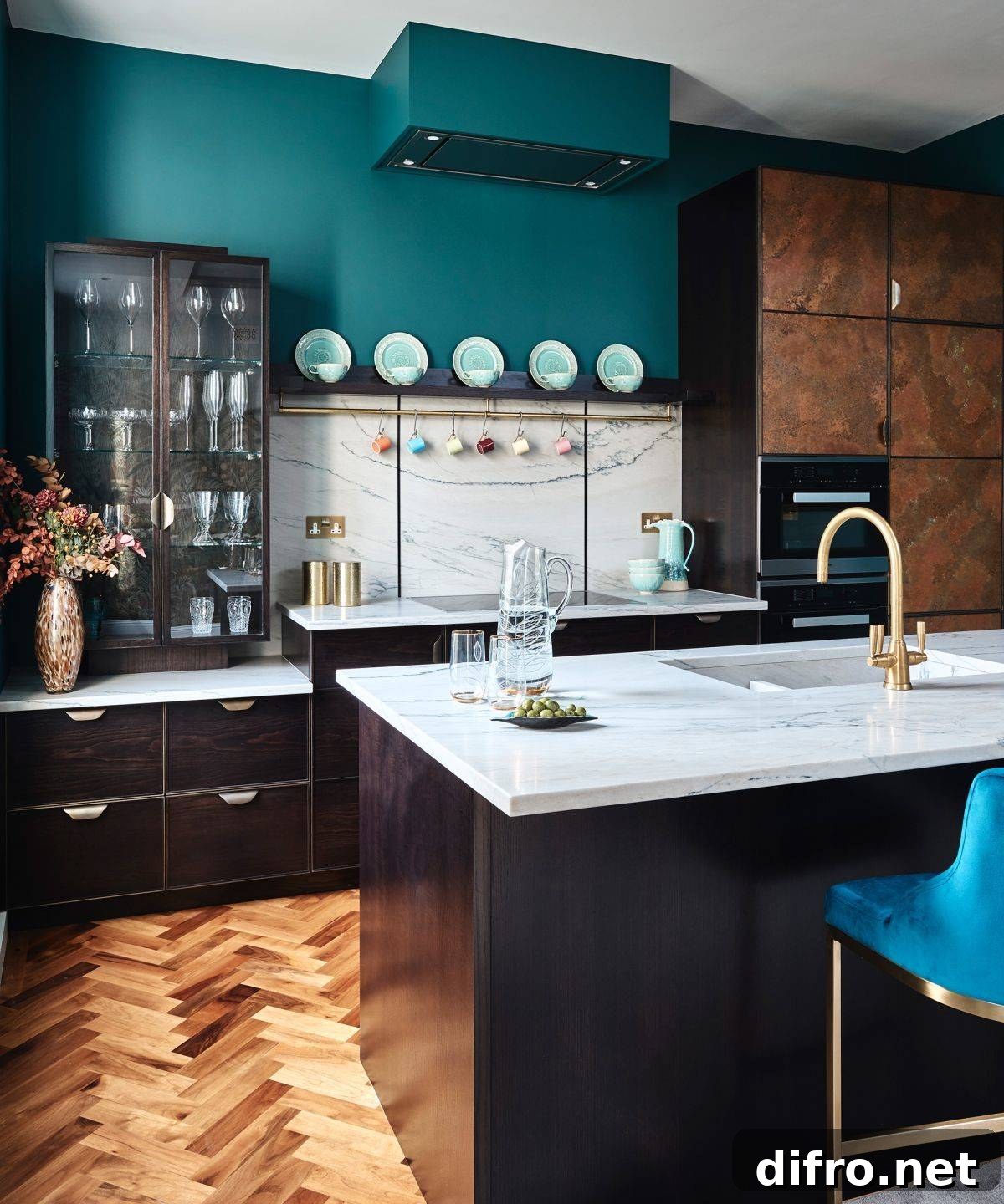 green kitchen paint against dark wood cabinets and marble countertops