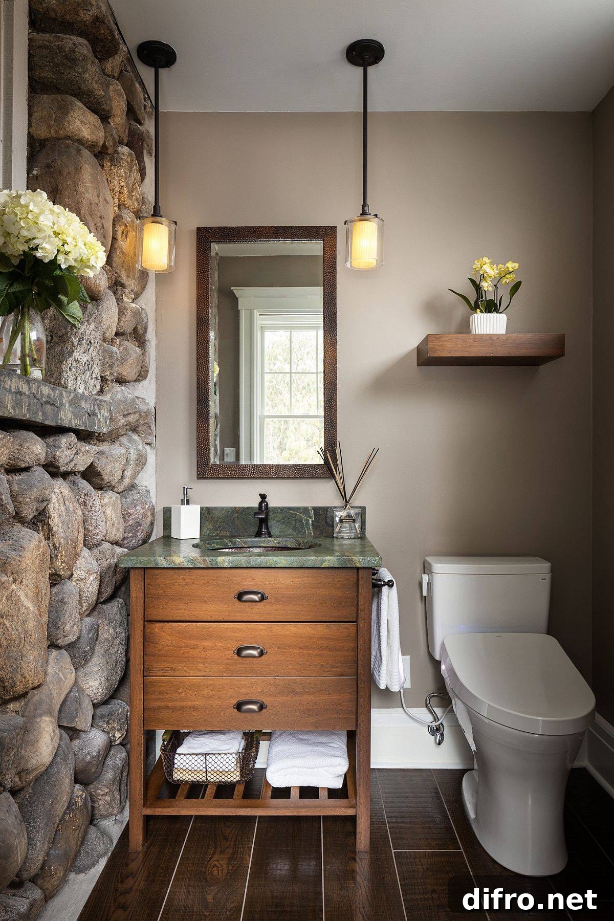 Cabin-style rustic powder room with stone wall