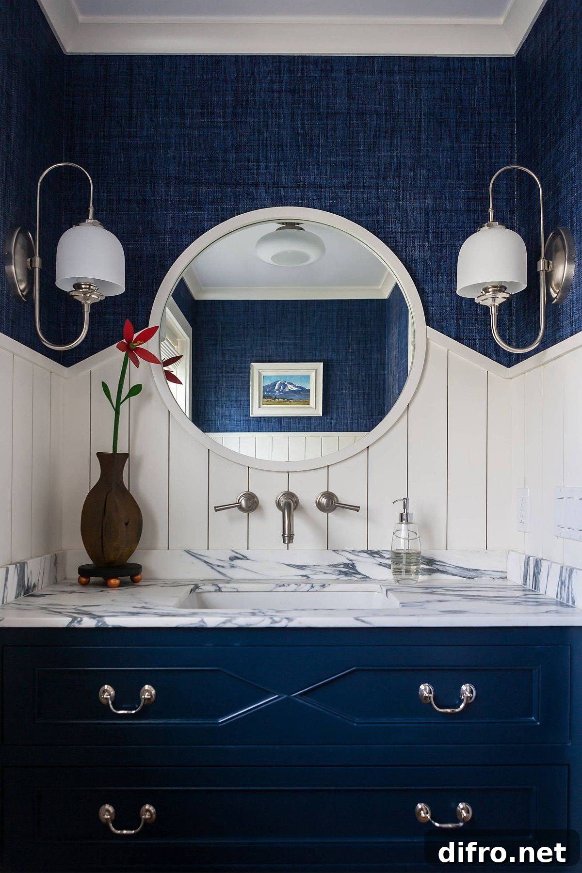 Blue and white beach-style powder room with marble countertop