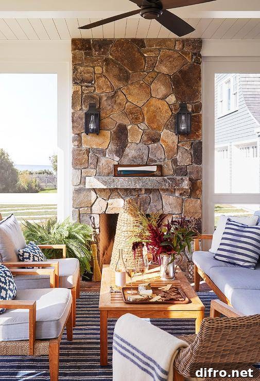 Gorgeous cottage sunroom with stone fireplace