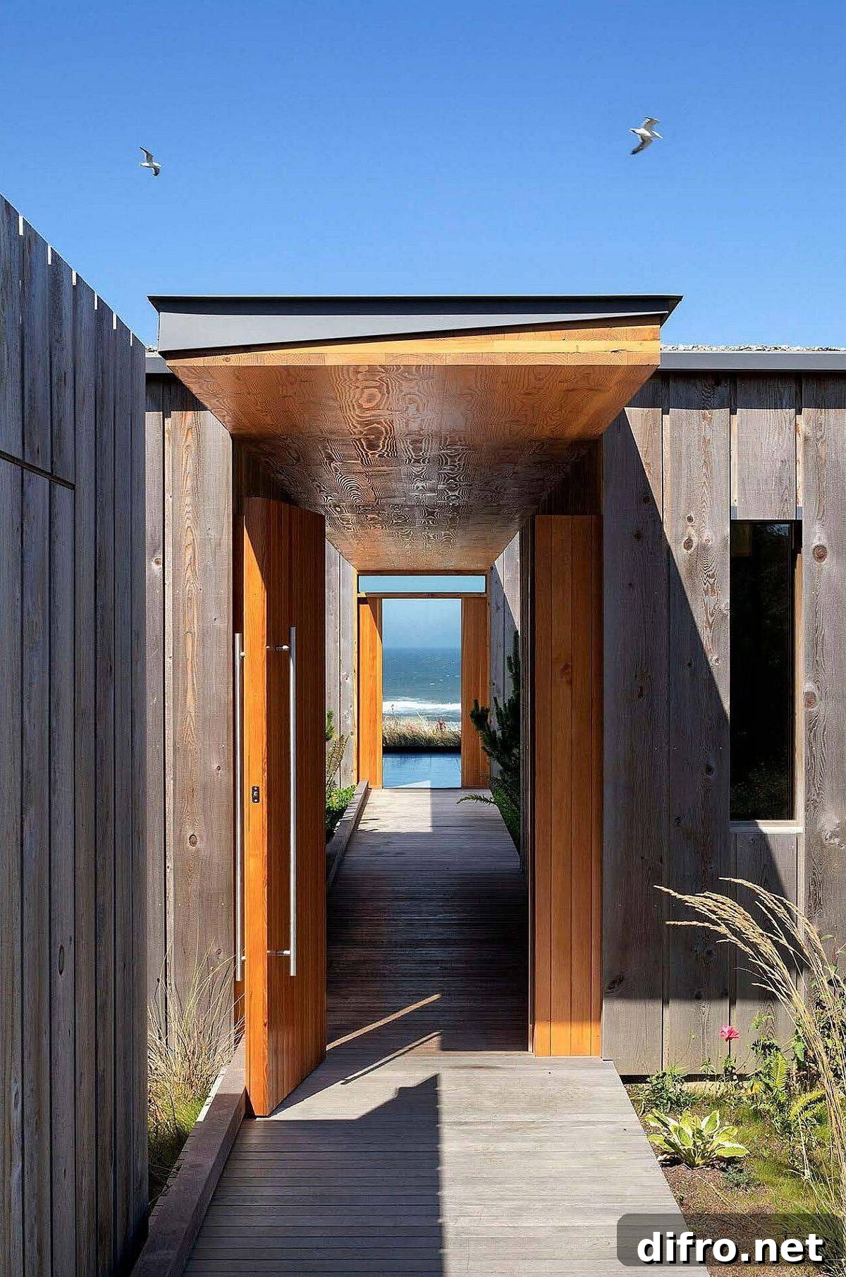 Walkway leading to infinity pool and offering a view of the mighty Pacific
