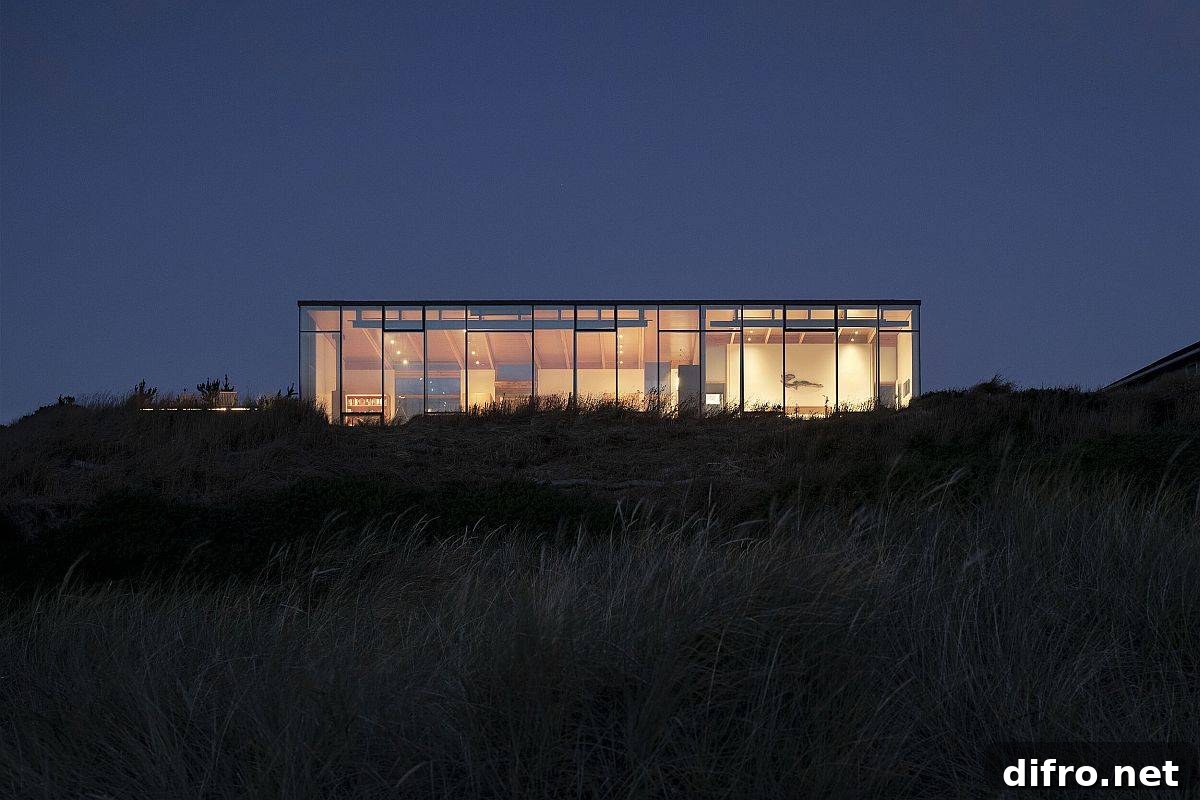 Warm lighting and smart design ensure the coastal home stands out from the crowd