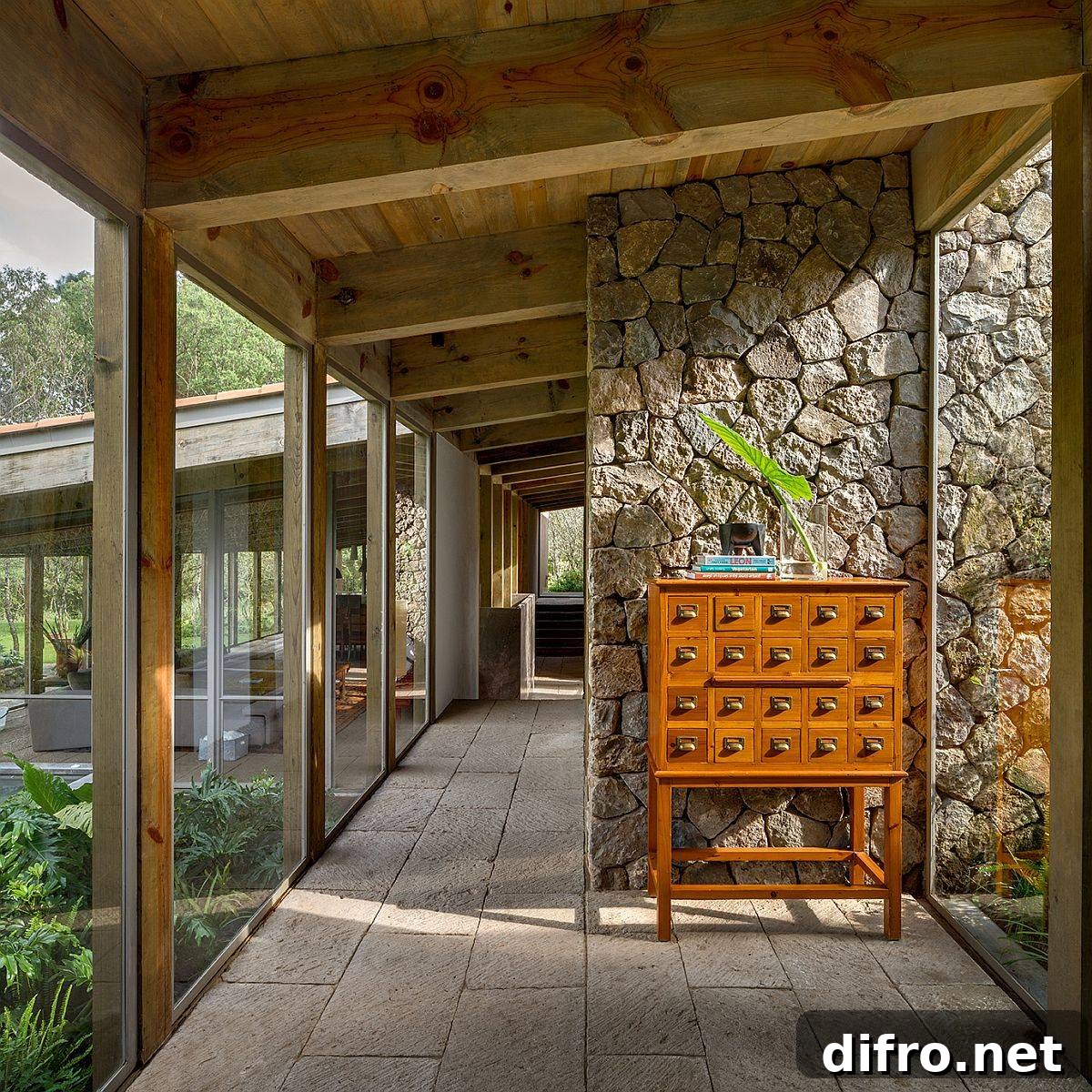 Wooden ceiling along with stone walls and glass floor-to-ceiling walls usher in a whole world of textures