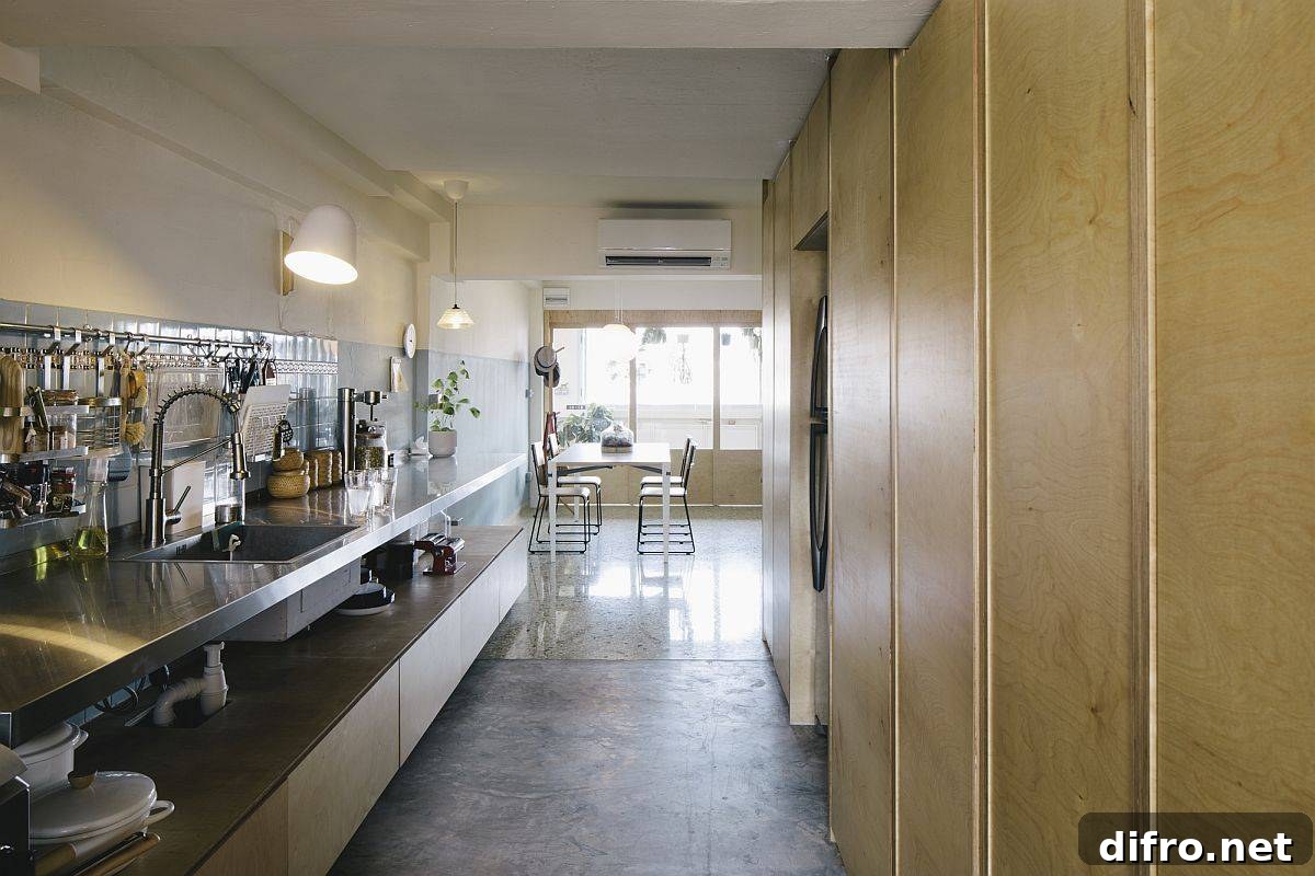 Kitchen with custom cabinetry and blue-tiled backsplash