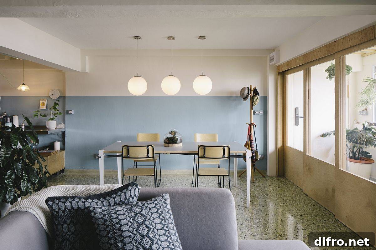 Dining area lit by natural light and pendant lights