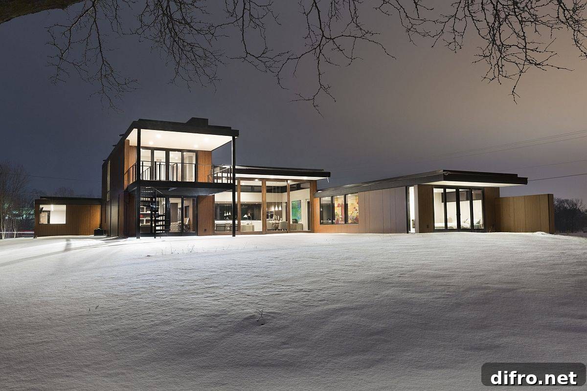 Rear glass walls opening the house to the outdoors