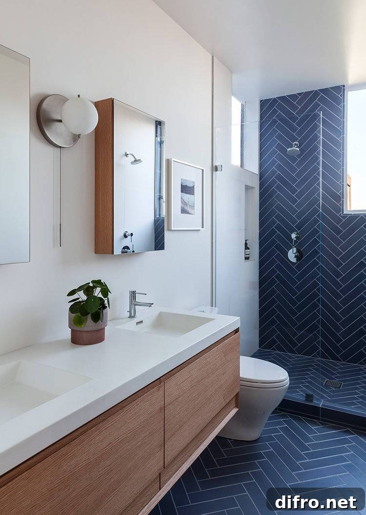 Blue herringbone tile in contemporary bathroom