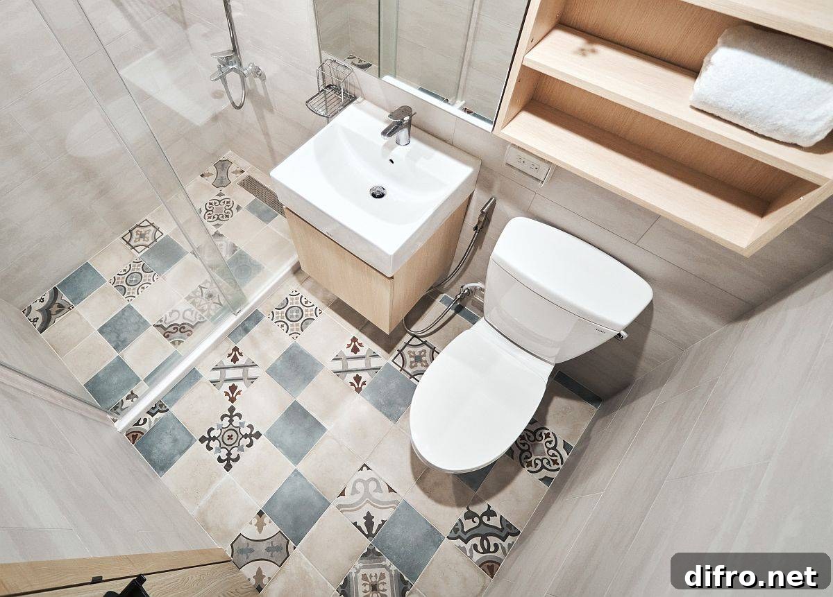 Small bathroom with patterned floor tiles adding character to the compact space