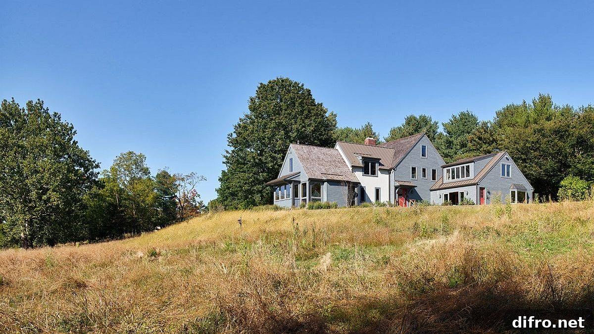 Meadows House exterior overlooking meadow and stream