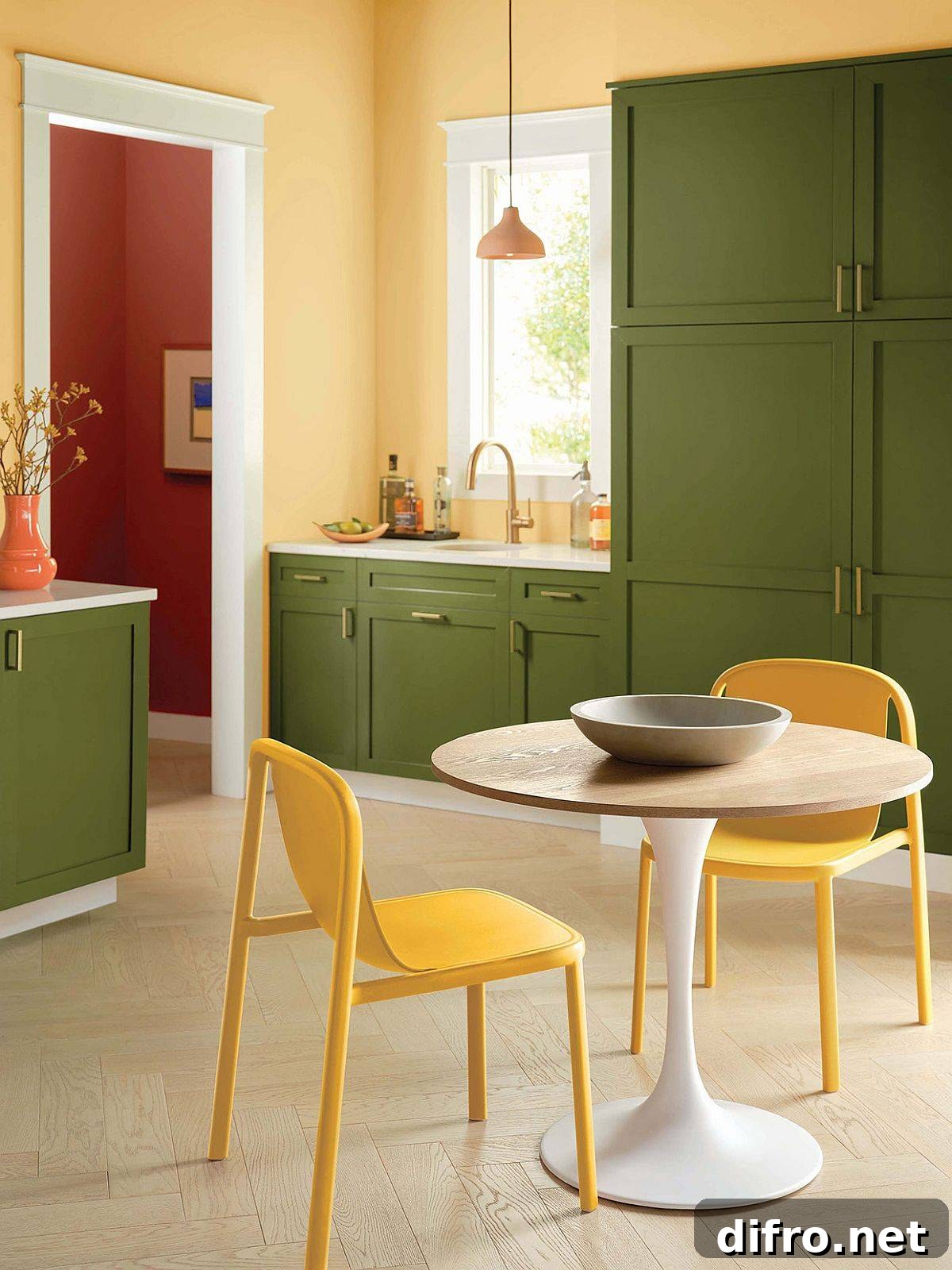 Green cabinets with yellow in midcentury modern kitchen