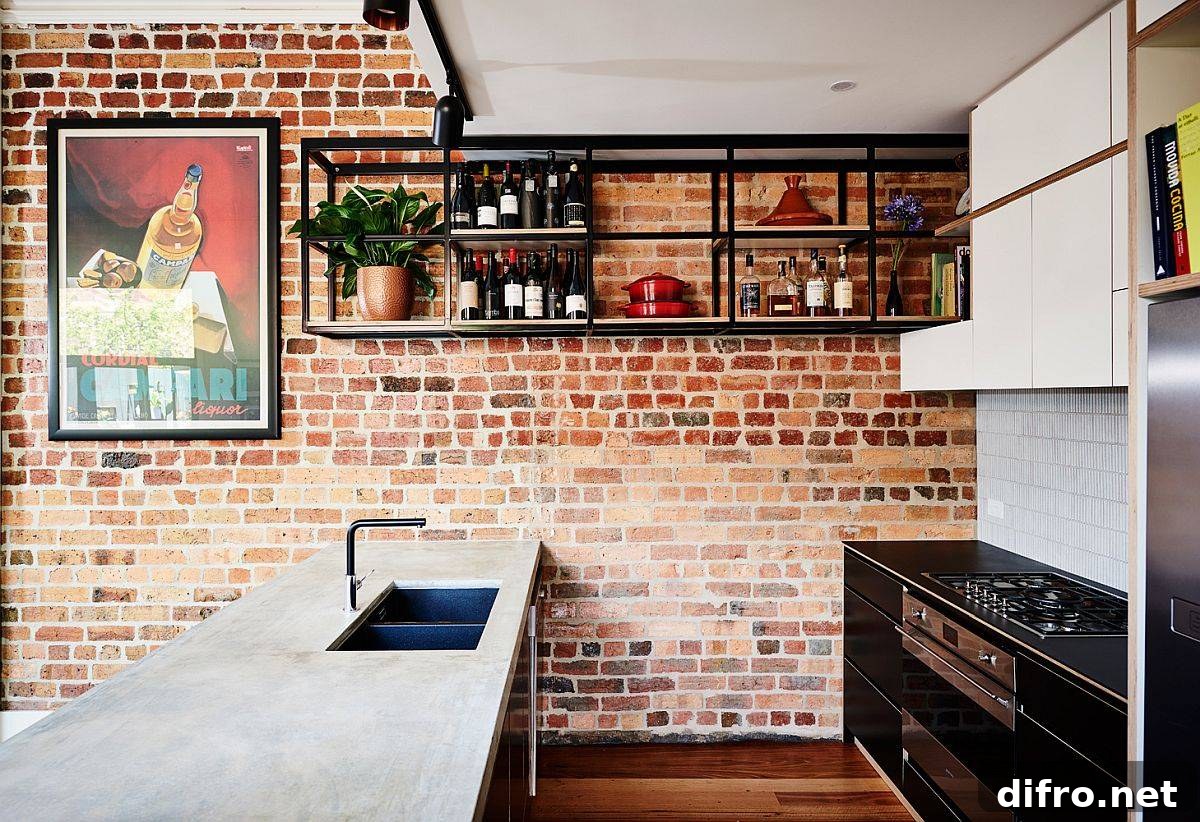 Kitchen with exposed brick wall, suspended wine shelf and smart island