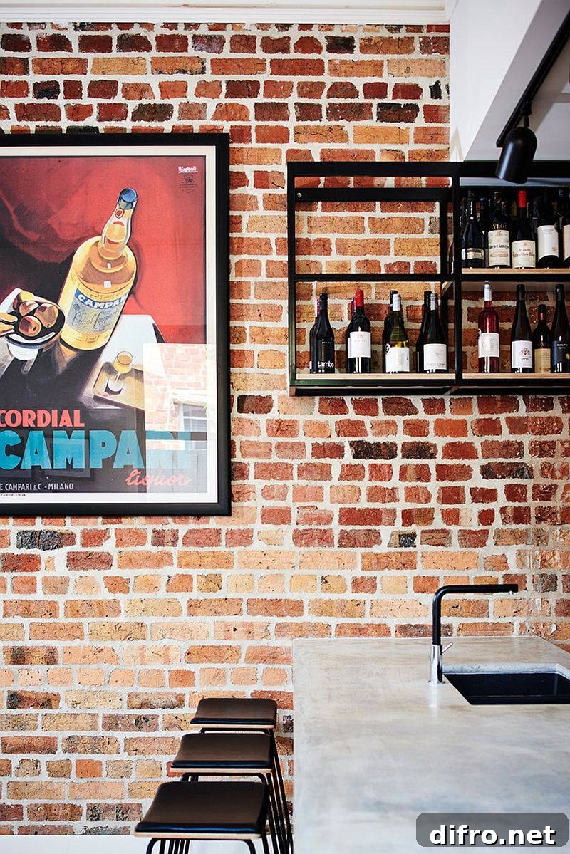 Suspended wine bar and exposed brick backdrop in Northcote kitchen