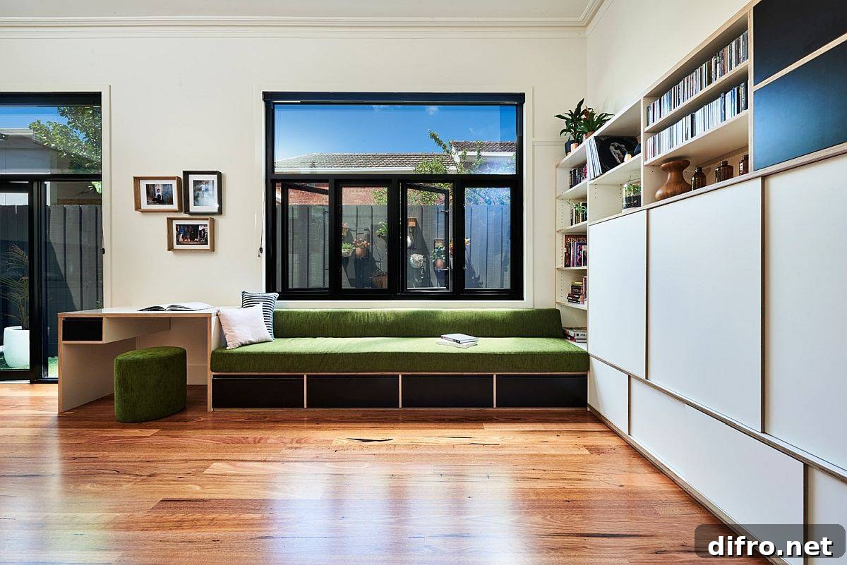 Built-in bench for family room with smart workstation in Northcote home