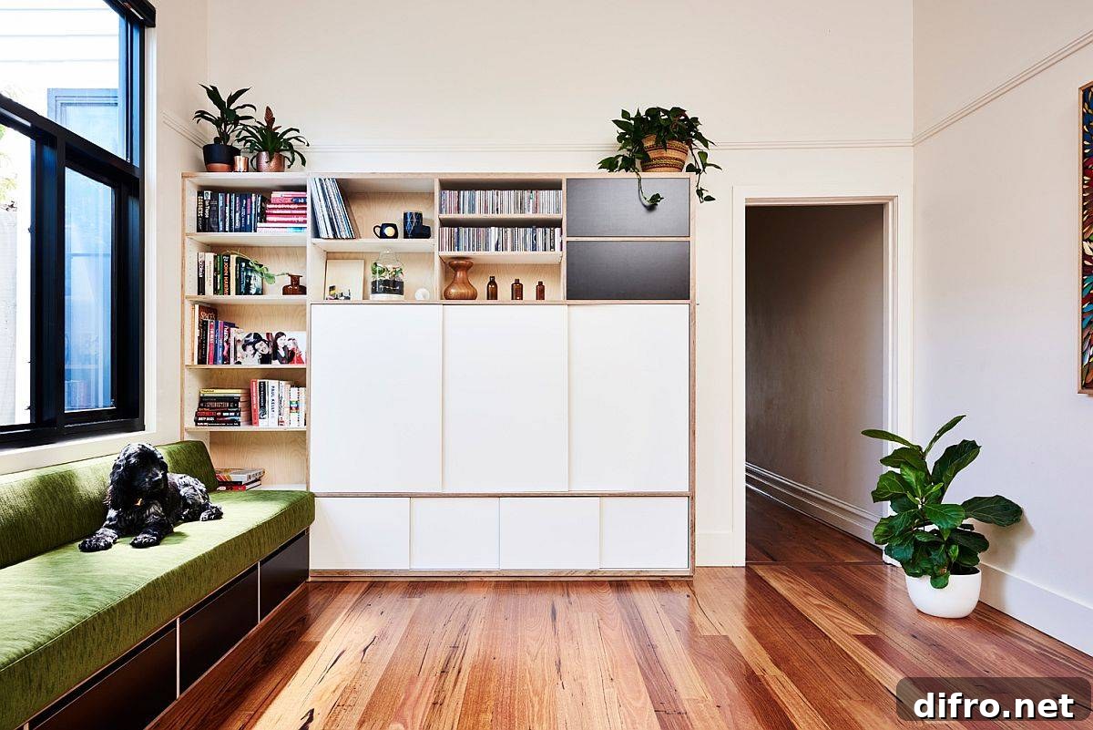 Custom storage, TV unit and bookshelf that multi-tasks in the family room