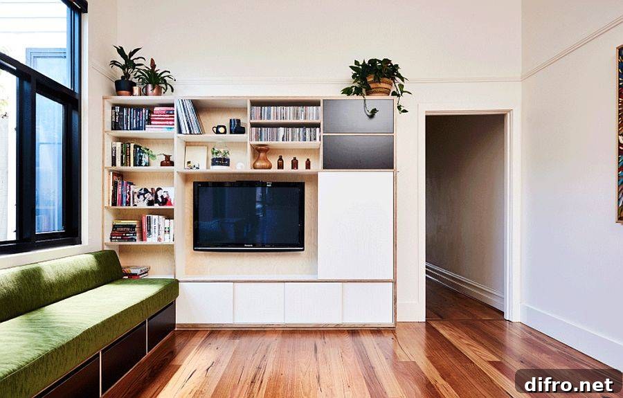 Bespoke storage and TV unit expanding the family room's storage capacity