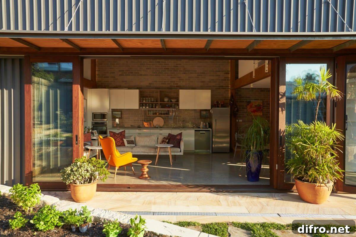 Framed glass doors open the small living area to the garden outside
