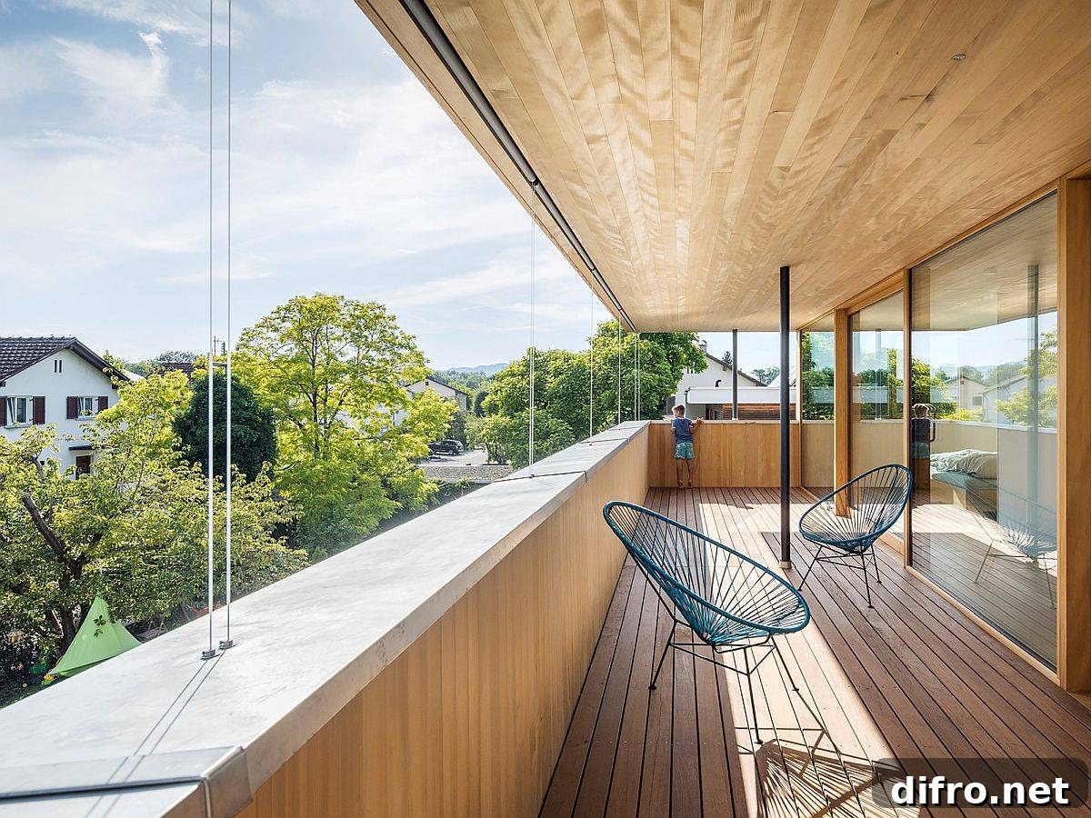 Sheltered balcony on the upper level of the house with ample shade offers lovely views
