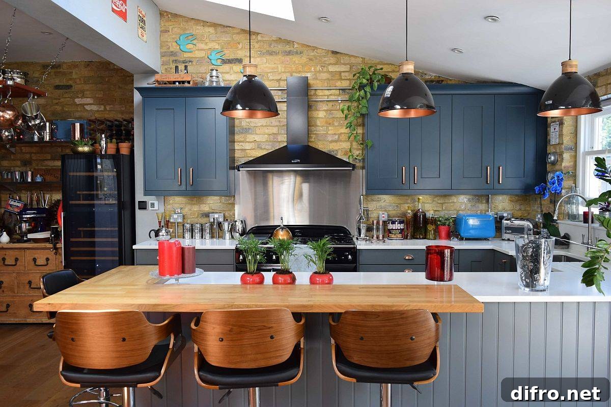 Modern farmhouse kitchen with L-shaped wooden breakfast bar and deep blue cabinets