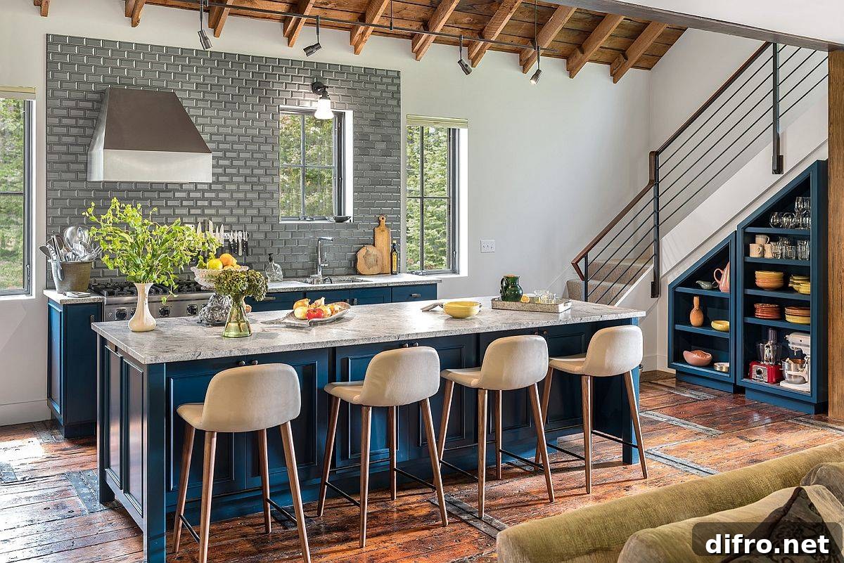 Stone countertops and bright blue island balancing modern and farmhouse elements