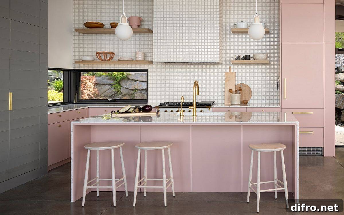 Light pink adds glam to this modern eat-in kitchen with a view of the outdoors