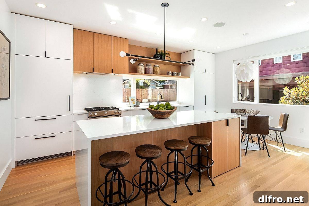 Charming modern kitchen in white and wood with single-wall design and a spacious island