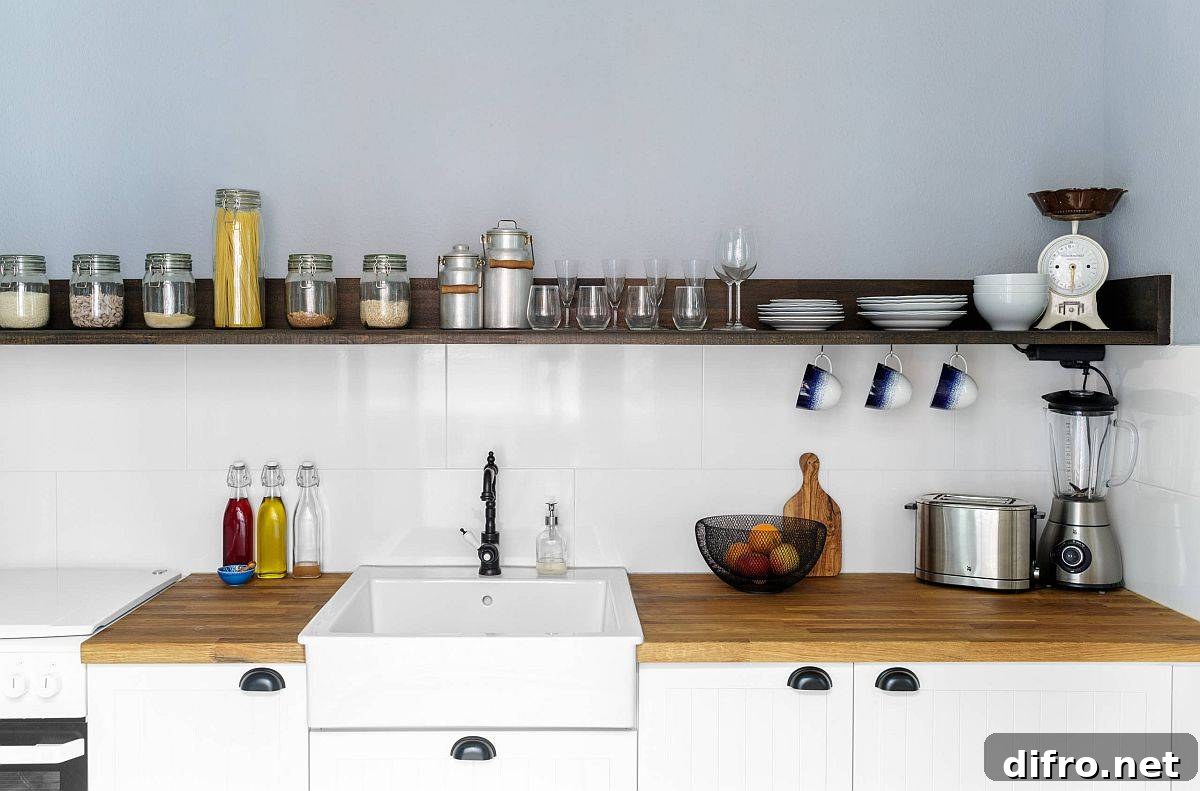 Slim floating wood shelf in a one-wall kitchen