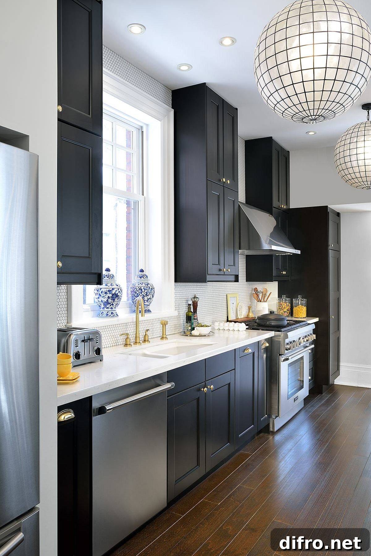 Dark cabinets contrast with gray storage units in a single-wall kitchen