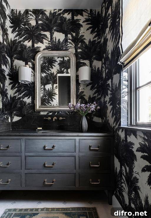 Black and white powder room with patterned wallpaper