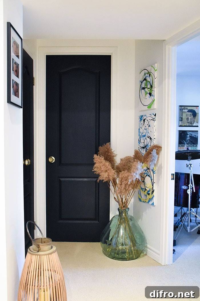 Black door coordinating with bedroom furnishings