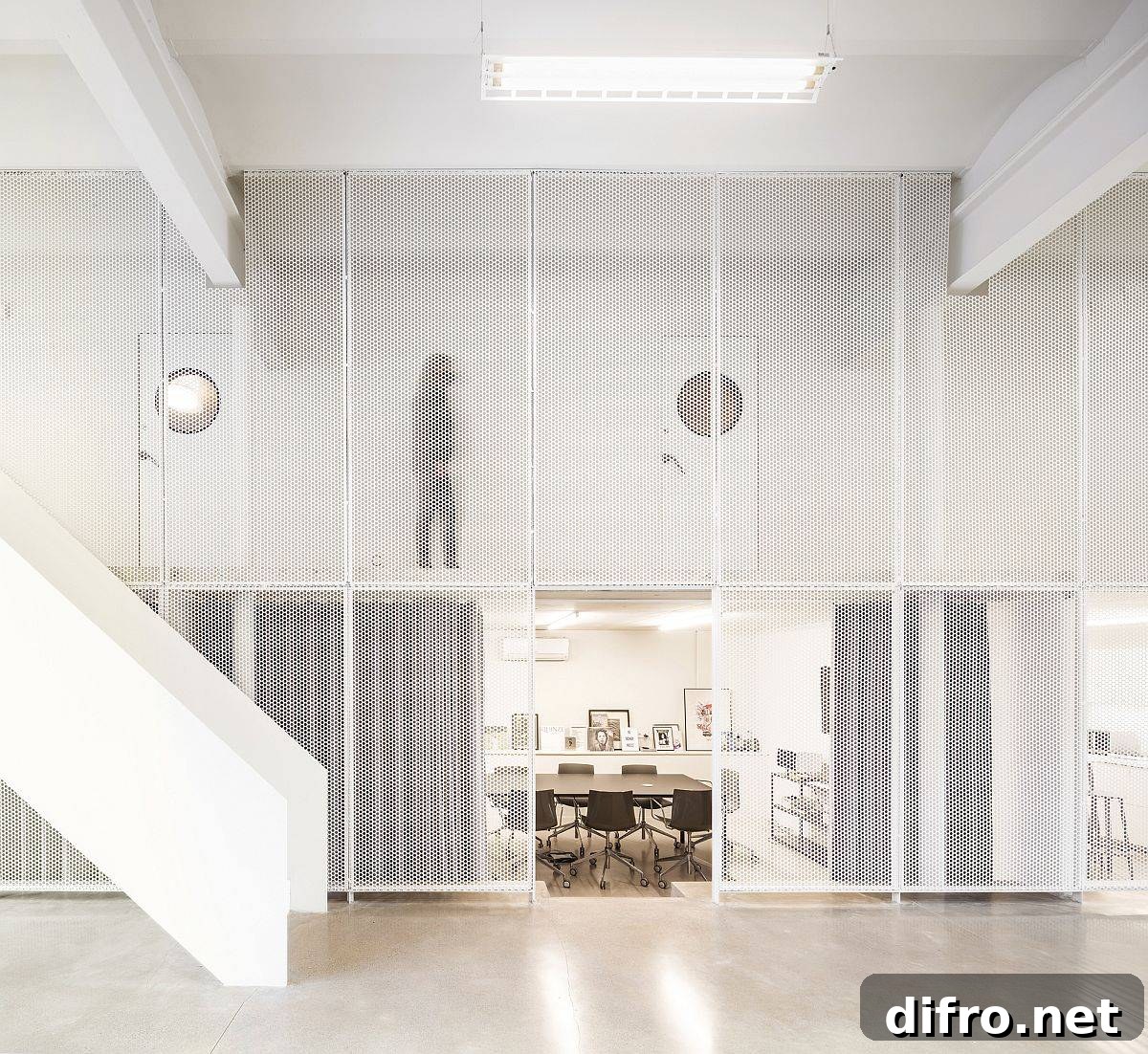 Metallic mesh frames delineate the public areas from the office space