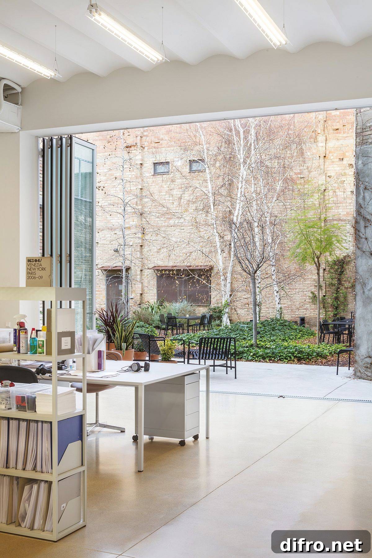 Spacious and light-filled office space inside the once warehouse with a modern-industrial style