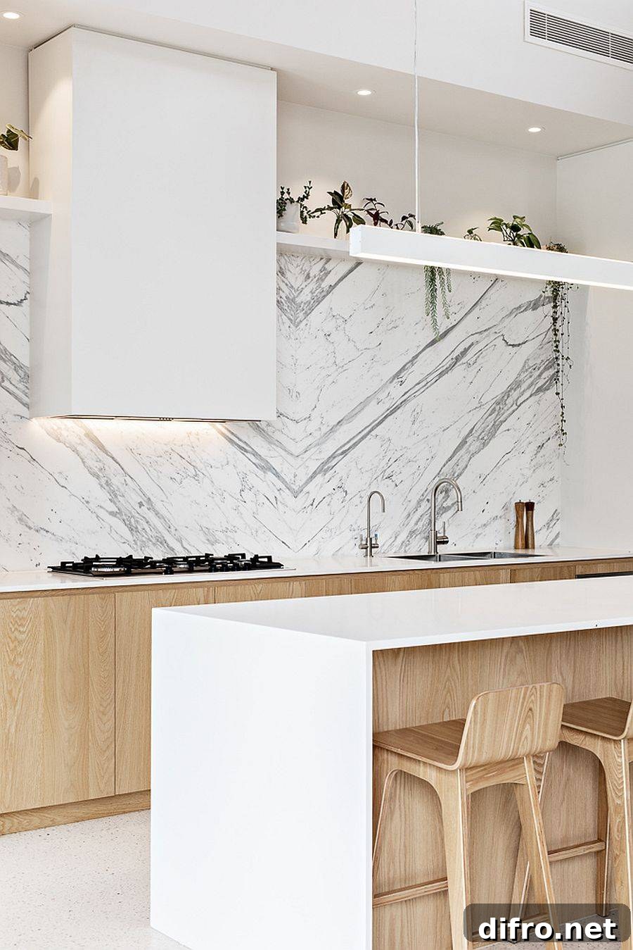 Minimal custom hood and range in white and wood kitchen