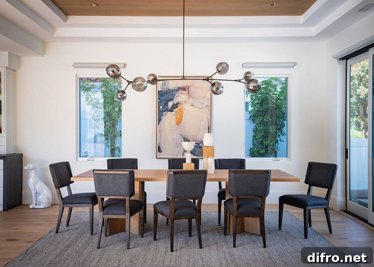 Wall art placed symmetrically between two windows