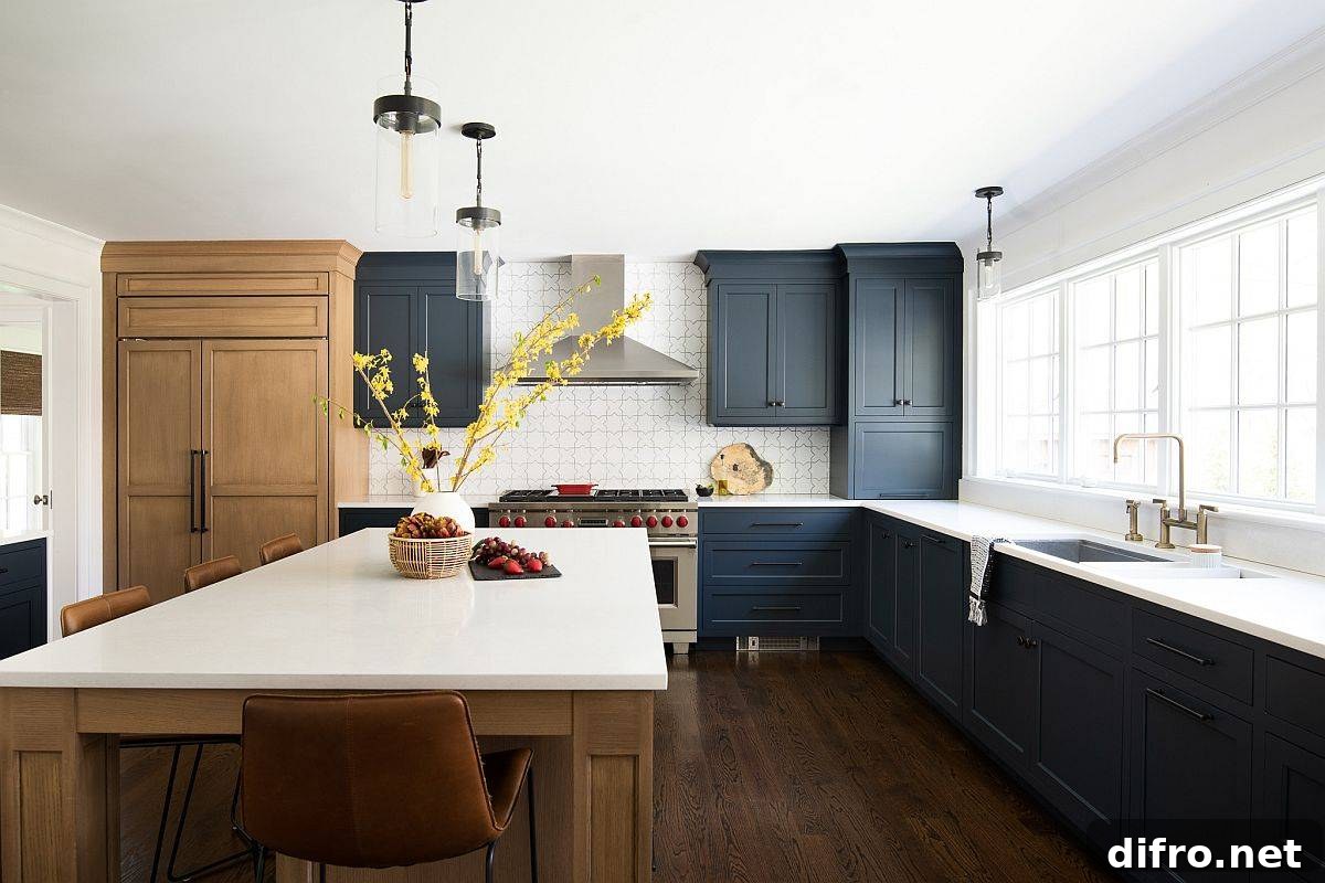 New York home kitchen with deep blue cabinets and engineered quartz countertops in white