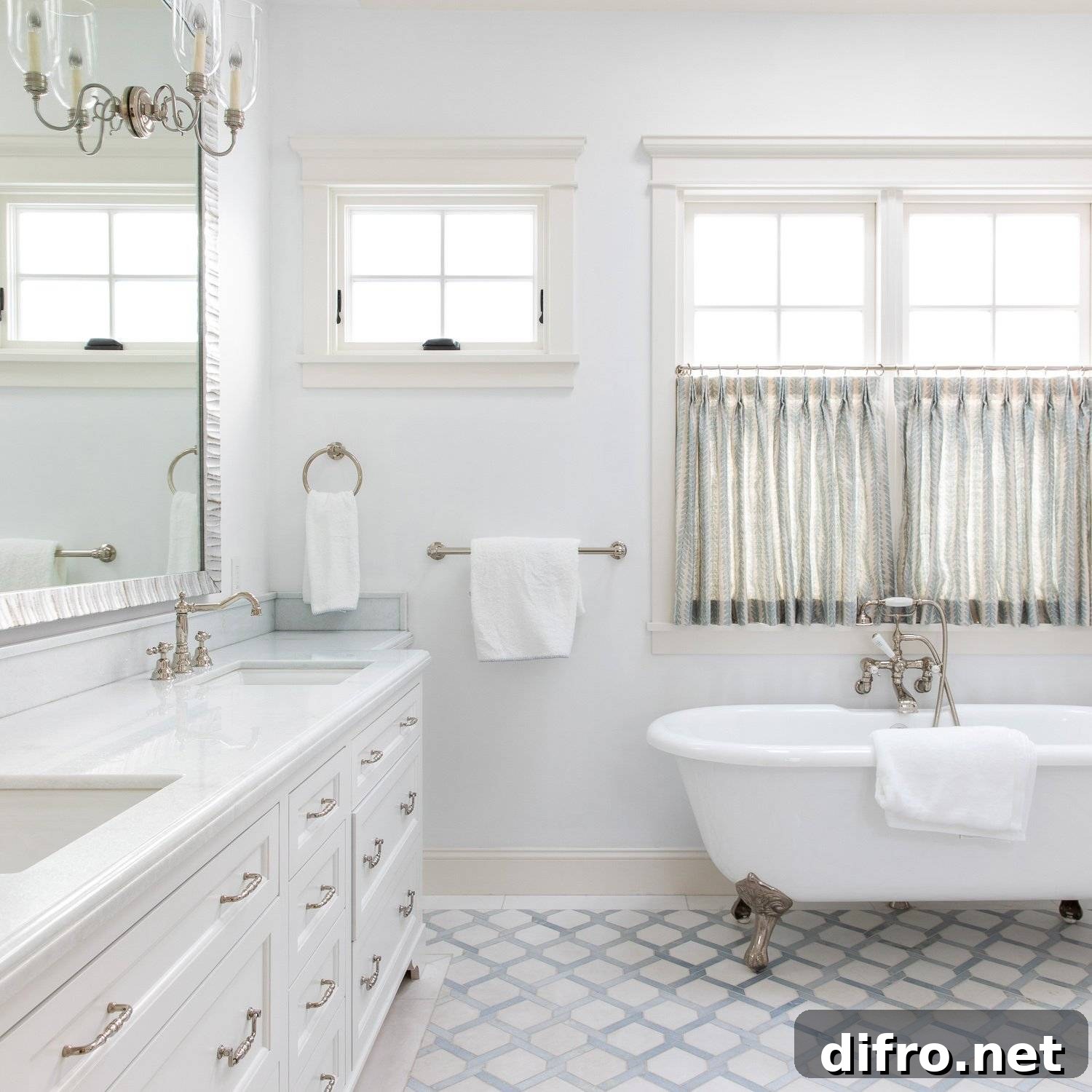 sheer curtains hanging on lower half of windows over tub