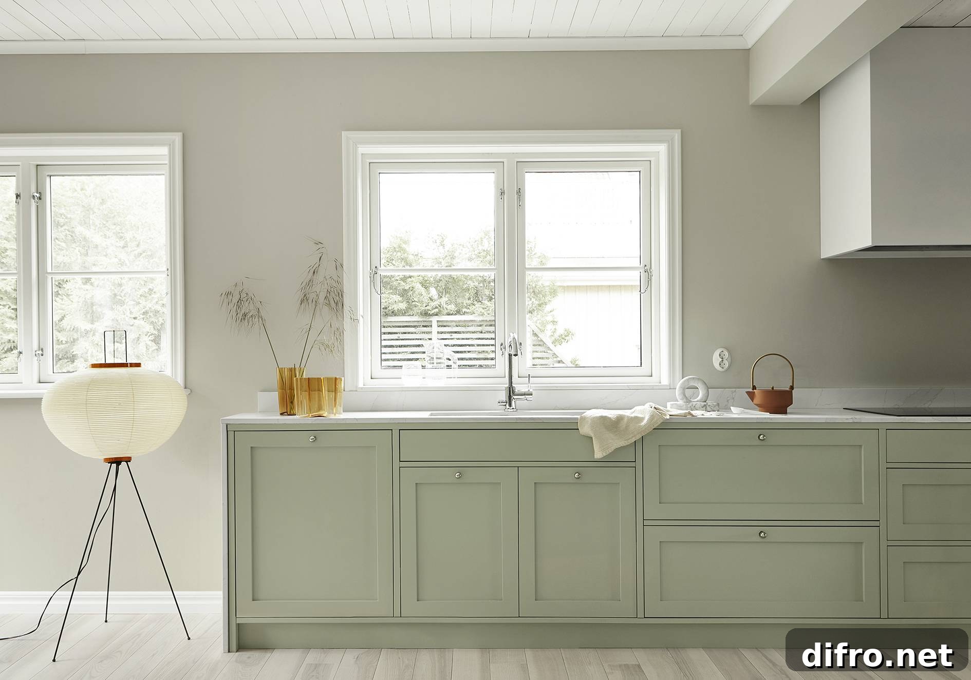 Modern pistachio kitchen with refined finishes