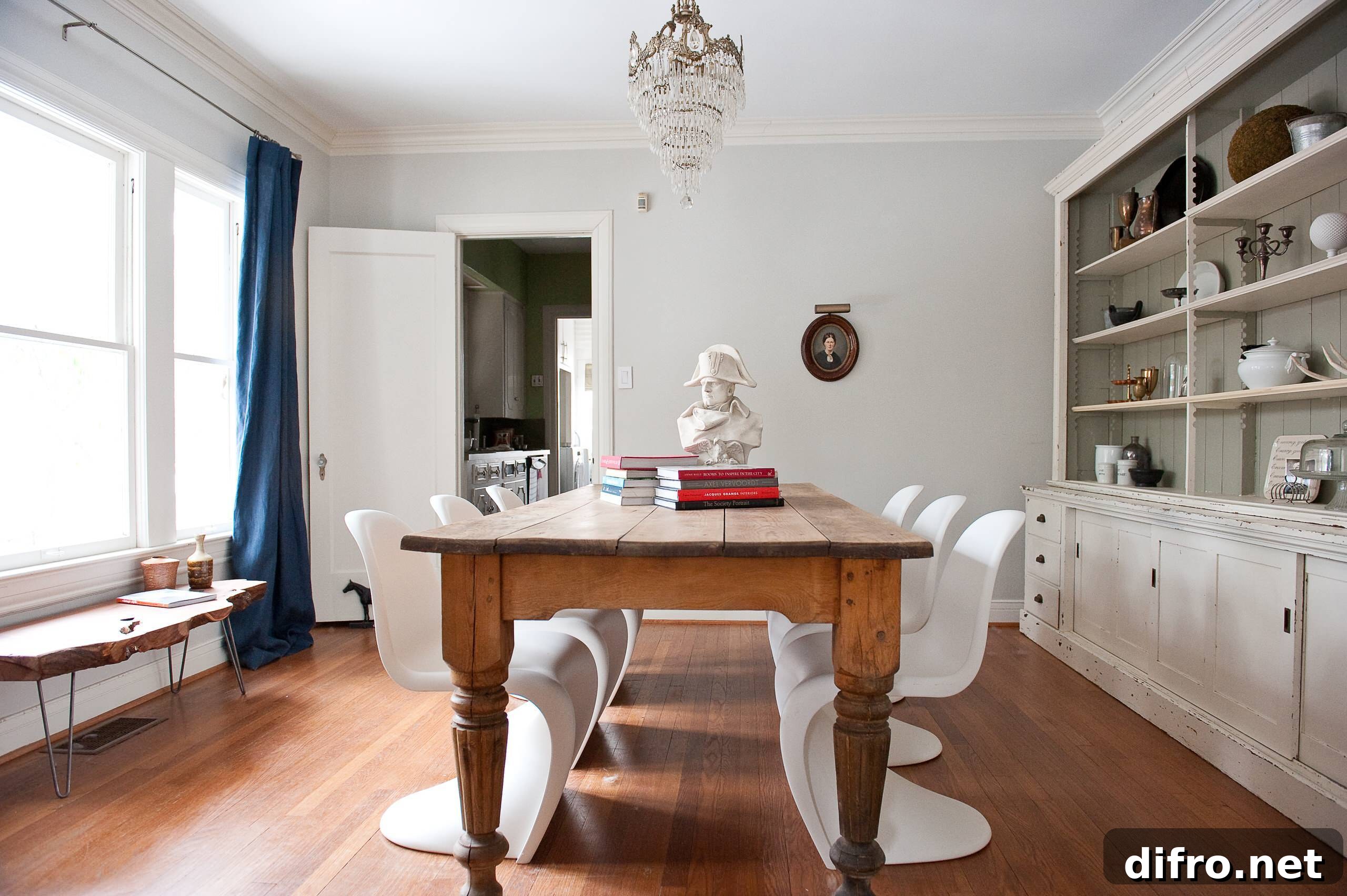 Eclectic dining room with vintage table and modern chairs