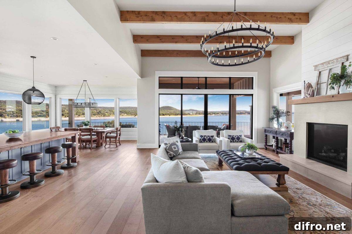 Open-plan living area with a fireplace and water views