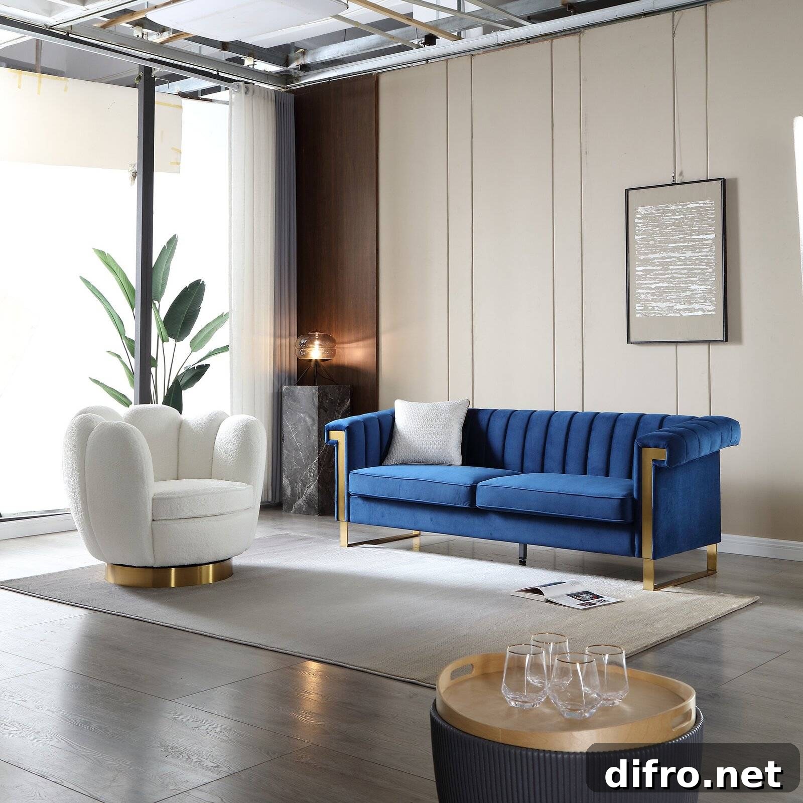 Modern living room with blue velvet sofa and gold accents