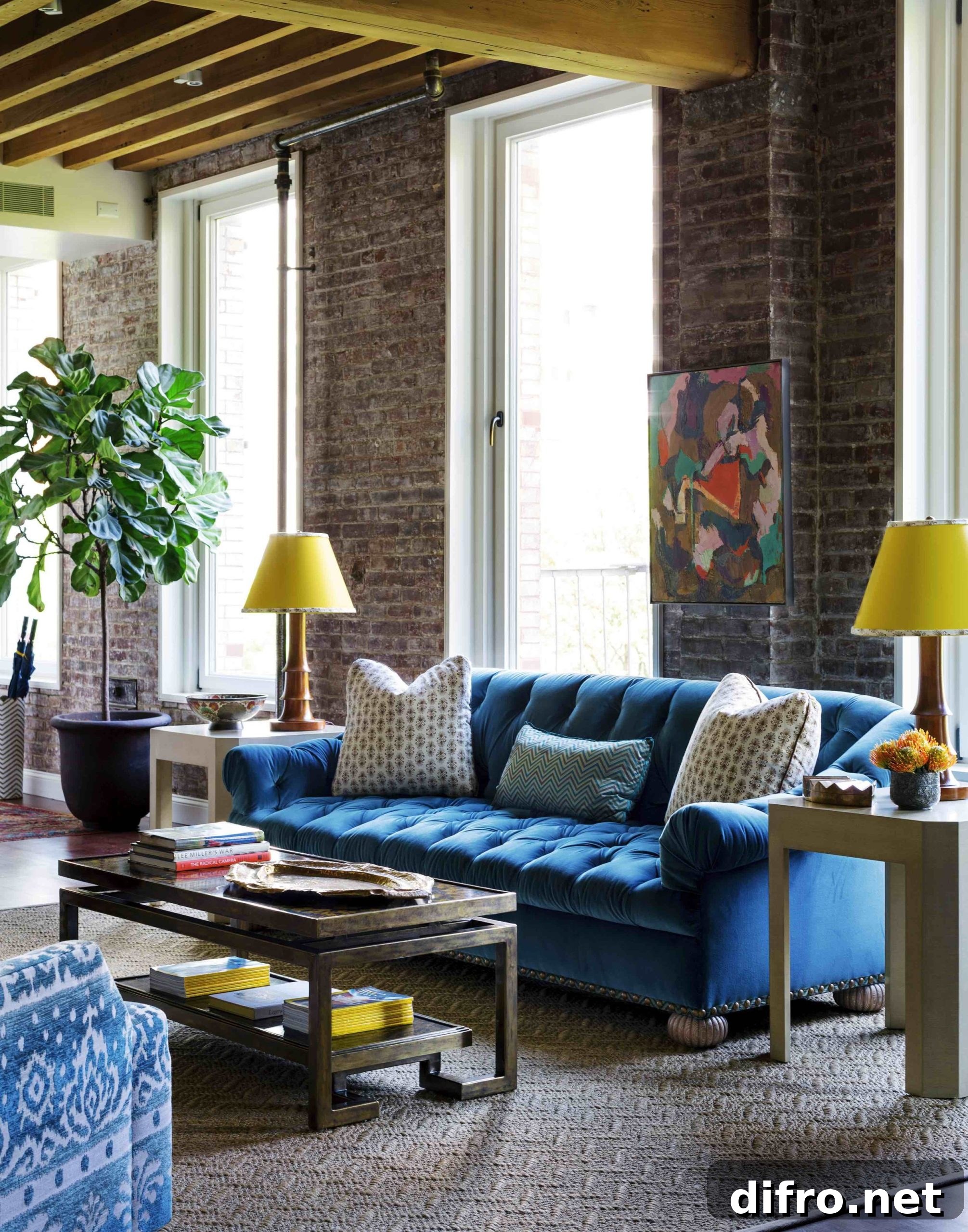 Exposed brick and blue sofa creating a charming combo