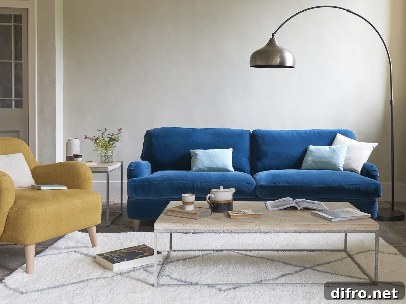Casual living room with blue velvet sofa