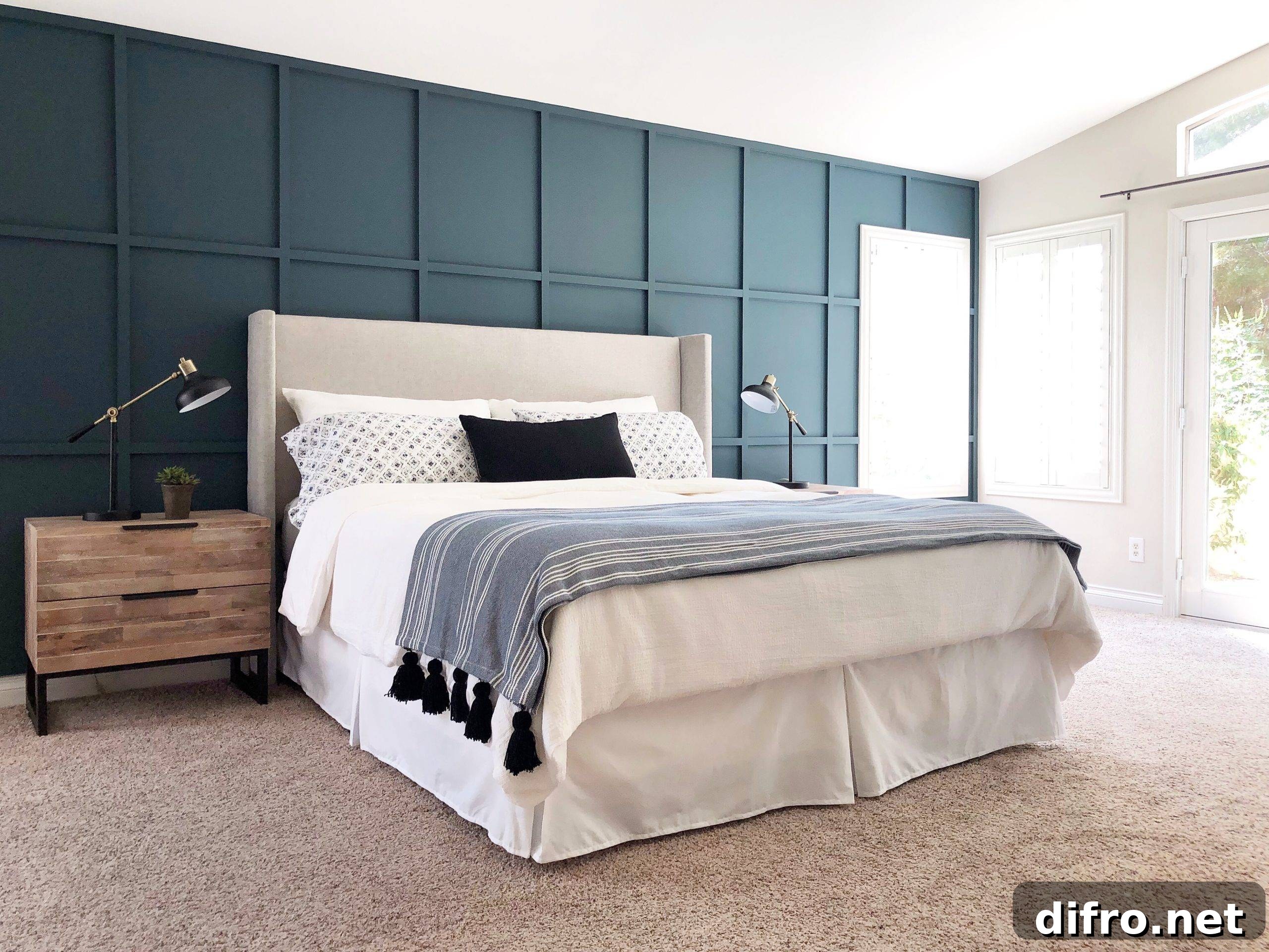 Cozy bedroom featuring a greyish-blue board and batten accent wall