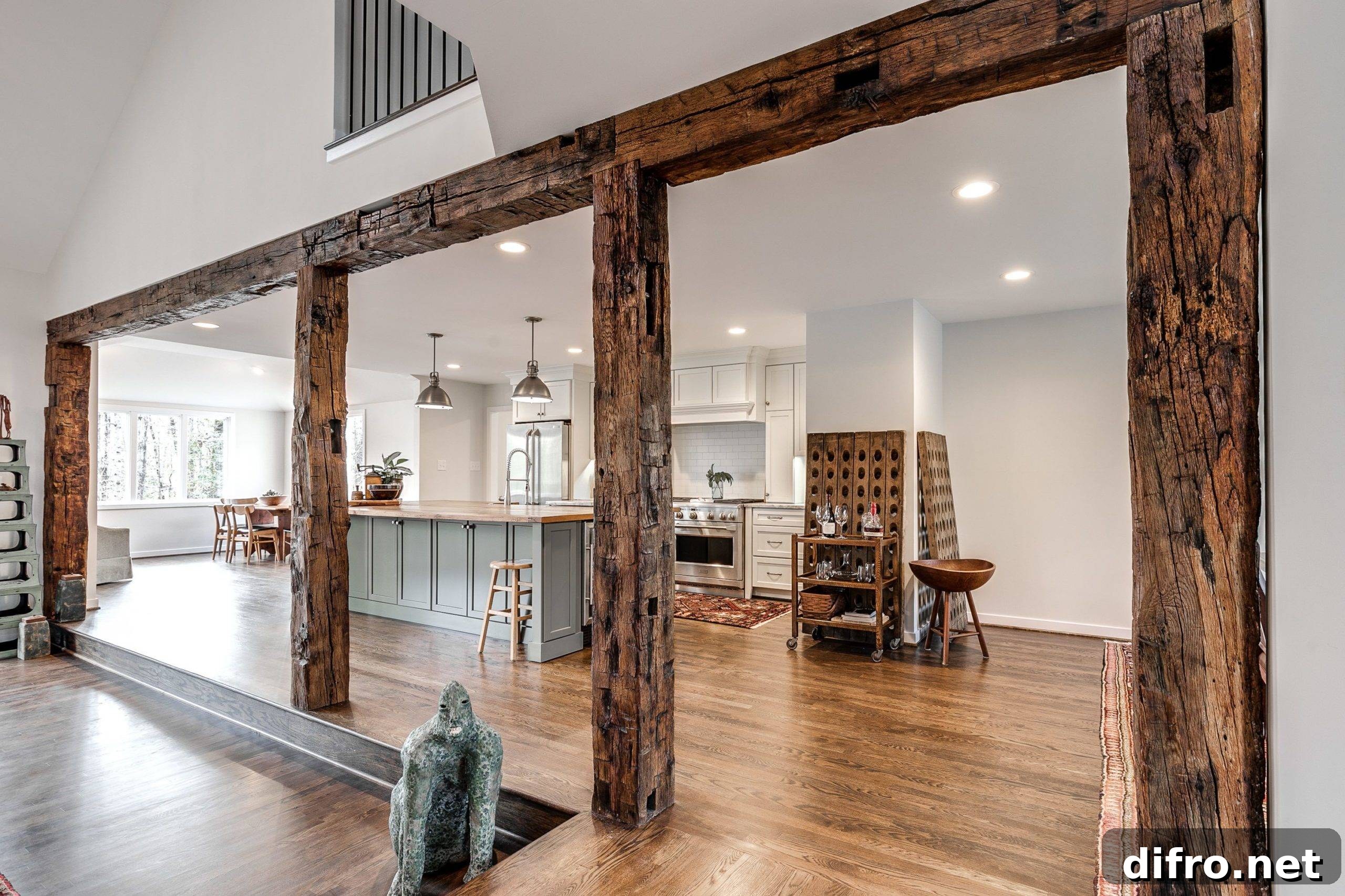 Wooden beam wood accent wall flanked by modern kitchen.