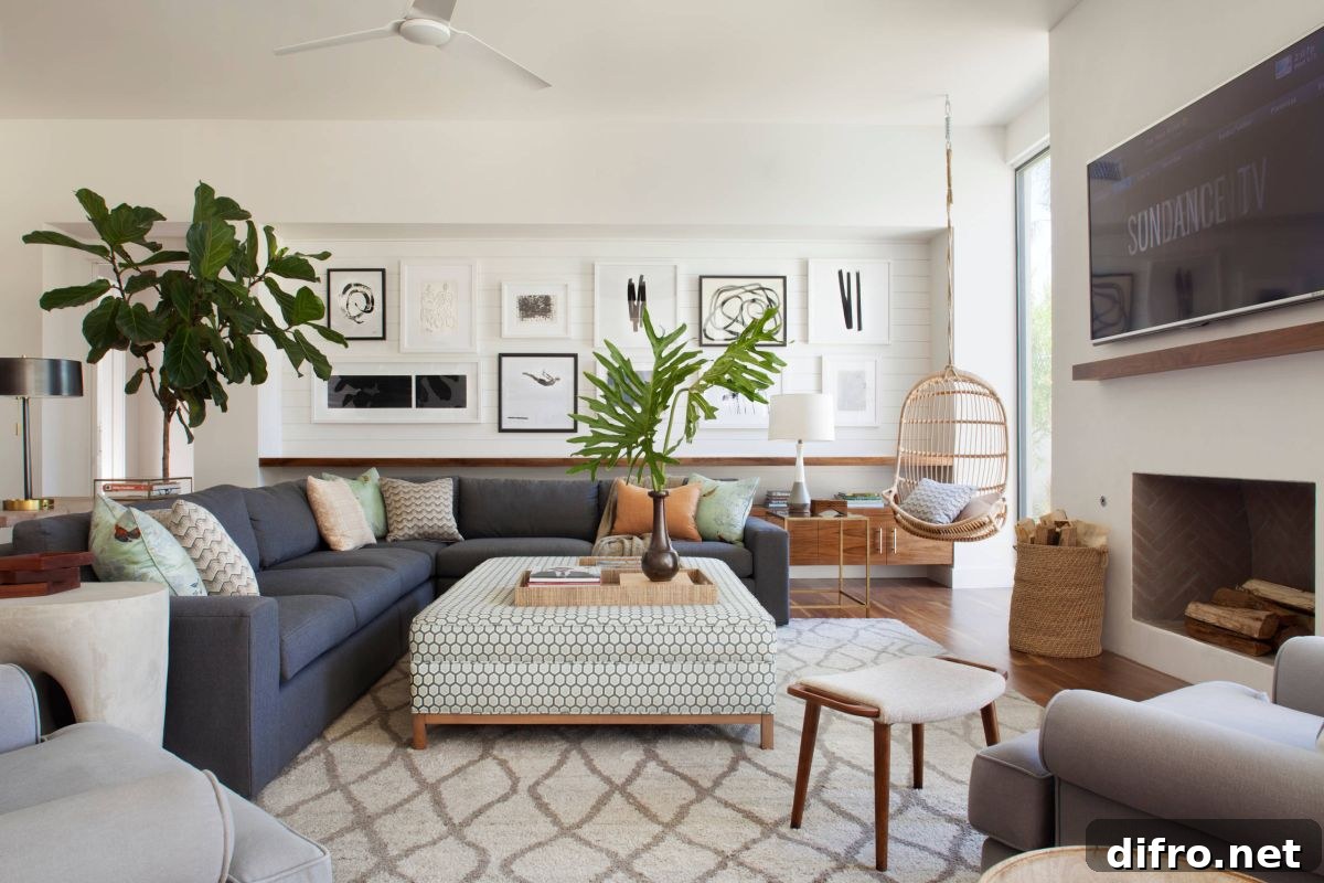 Midcentury modern living room in white with greenery adding color to the space